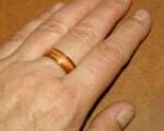 koa and juniper heartwood ring being worn