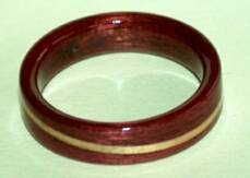 purple heart wood ring with a clear juniper spiraled band