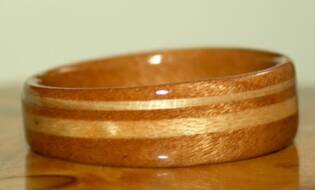 Jordan's cherry wood ring with a band of ash and a band of maple
