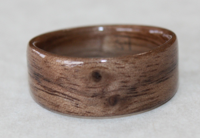mid toned black walnut ring with featured knots