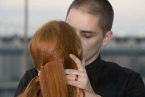 click for larger image of sallie and joel wearing his wooden ring