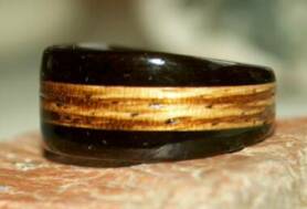 custom black wood ring with a zebra wood band