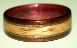featured oak knot inlay on koa wood ring
