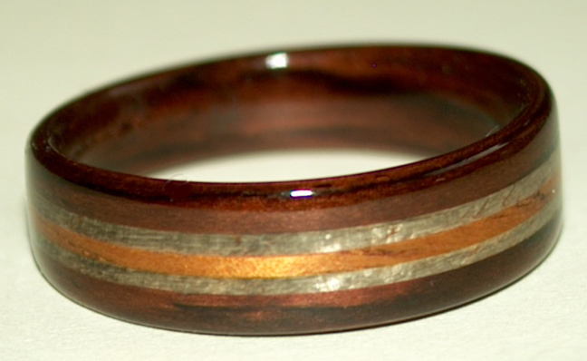 Rosewood ring with greyed maple and golden koa wood bands