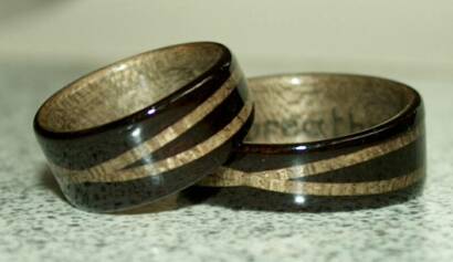Black wood Rings with crossed spiraled blue spruce bands and blue spruce liners ( Designed by and created for Breda and Marc)