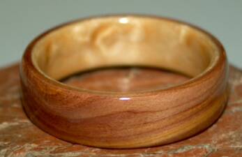 Juniper heart wood ring with birds eye maple liner from TOUCH WOOD RINGS