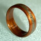 This ring is size 9.5, tapered, with an offset greyed maple band