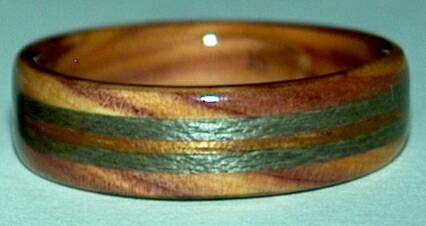 juniper heartwood ring with greyed maple and koa bands