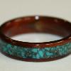 A wide TURQUOISE inlay on this dark Hawaiian Koa wood ring.