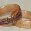 January 2012, Touch Wood Ring commission.  Juniper heartwood ring with crossed spiraled inlays of amethyst and ruby bordered by and lined with Birds Eye Sugar Maple. With a classic Birds Eye Maple Touch Wood Ring