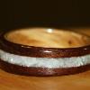 Black Walnut Ring with Mother of Pearl inlay and Oak lnterior.