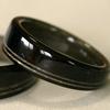 A tapered Blackwood ring with very narrow offset greyed maple inlays