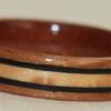Juniper heartwood, cherry, birds eye maple inlay with black wood borders