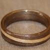 Black Walnut ring with a spiraled inlay of maple.