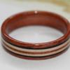 David made this ring for his Mum.  It is a Magnolia ring with Ancient Kauri, Apple Wood and African Blackwood inlays.