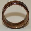 End view; Black Walnut ring with eucalyptus interior and three inlays