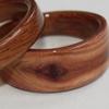 Juniper heartwood ring with a featured knot.