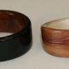 Juniper heartwood ring with natural featured knot and a willow interior liner.  Blackwood ring with Ancient Kauri interior.