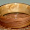 JUNIPER HEARTWOOD RING with a birds eye maple liner.