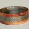 Juniper heartwood ring with greyed maple inlay and liner