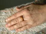 wooden ring on the middle finger
