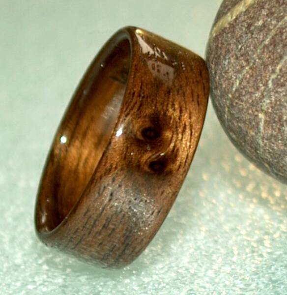 Natural Yin Yang markings on a black walnut wood ring.